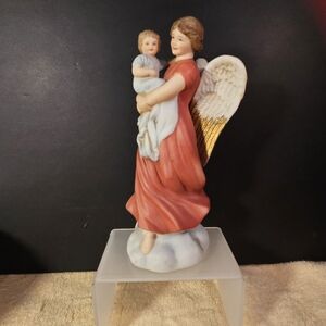 VTG Homco Porcelain Bisque Guardian Angel (Model #1414)  holding an infant.